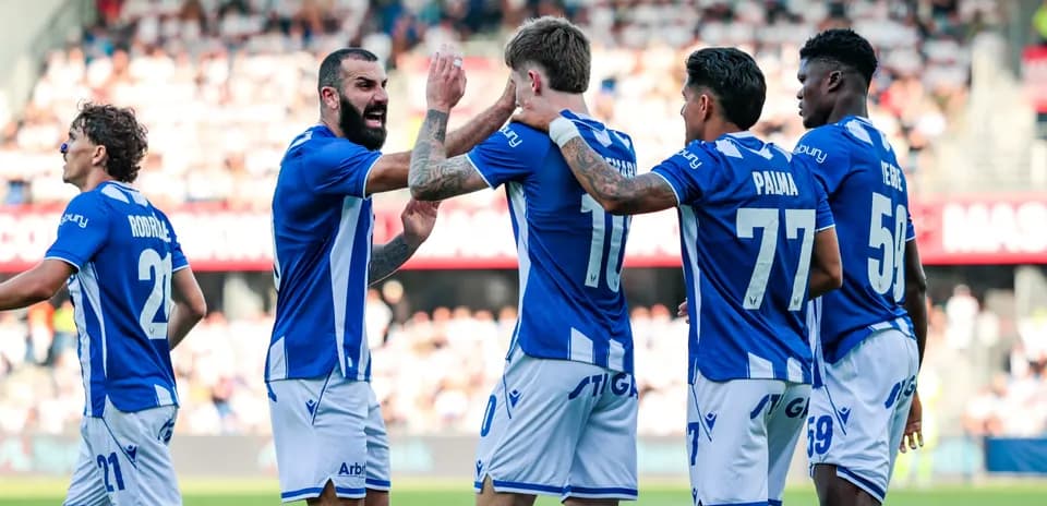 Players celebrating a goal during the match