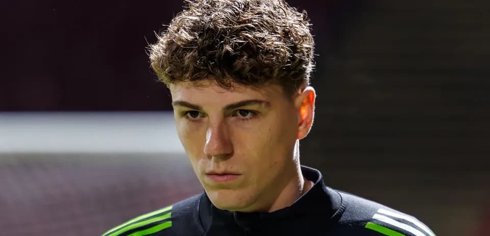 Goalkeeper in black kit preparing for match
