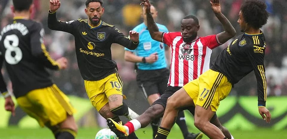 Players competing for the ball during match