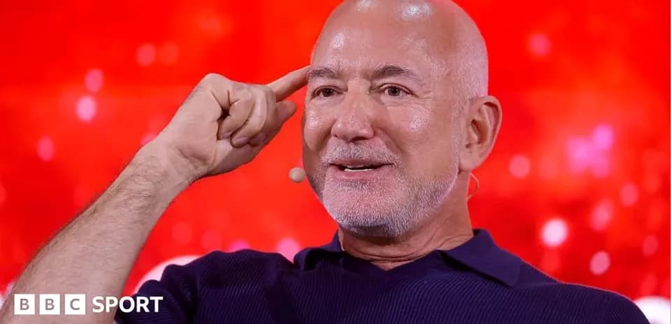 Person gesturing while speaking at event