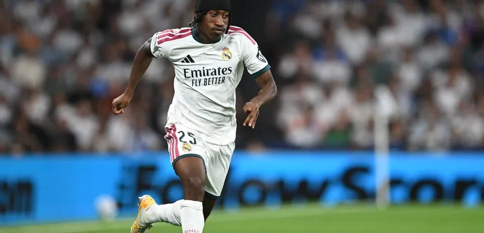 Player in Real Madrid kit running on the field