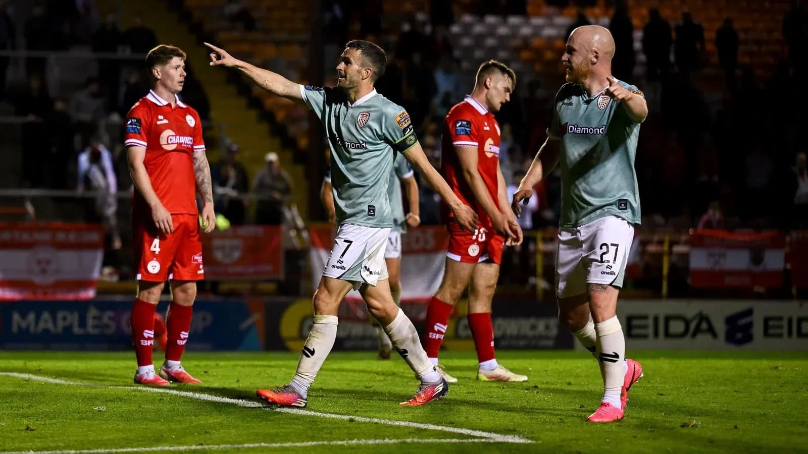 Players celebrating after scoring a goal in match