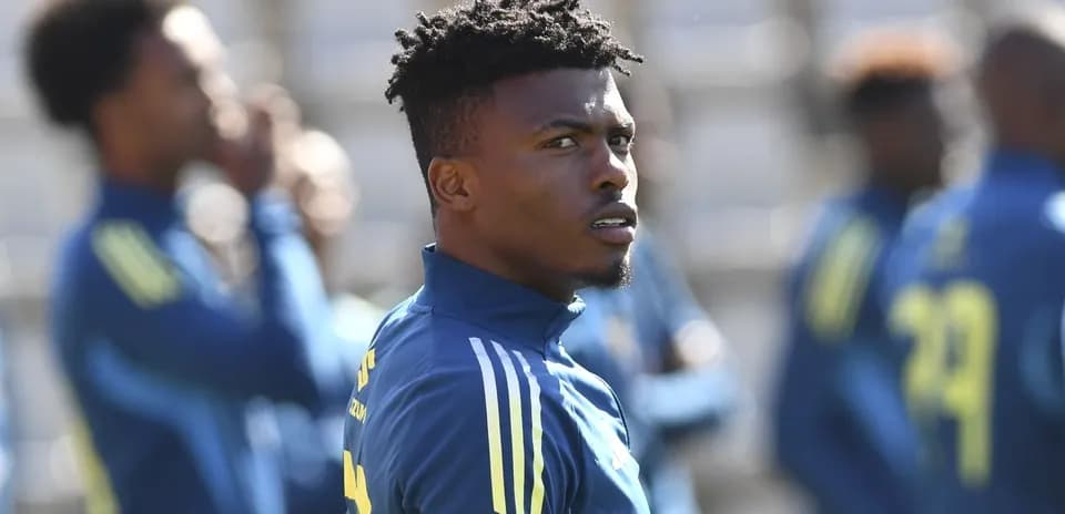 Player in training session with teammates in background
