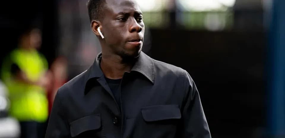 Player walking while wearing wireless earbuds