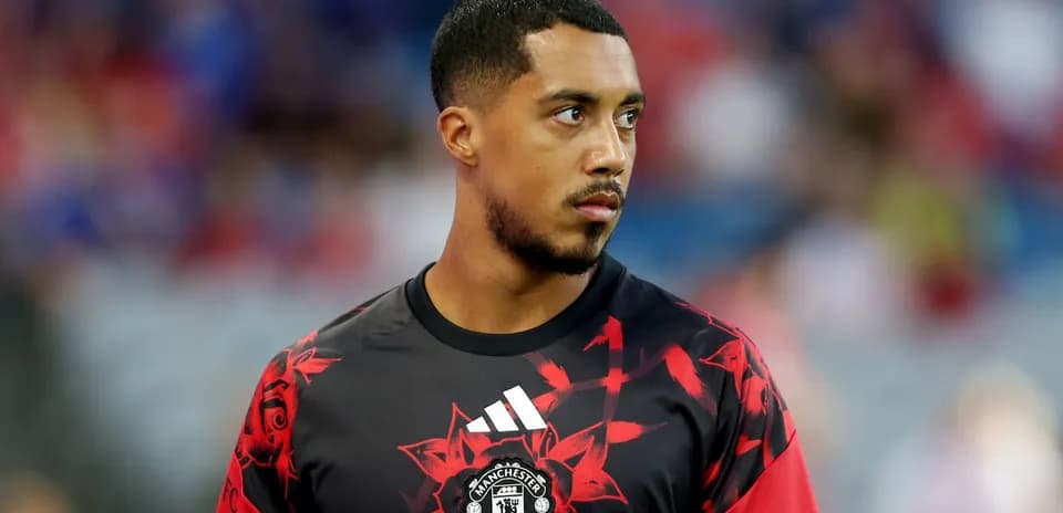 Player warming up in Manchester United training kit
