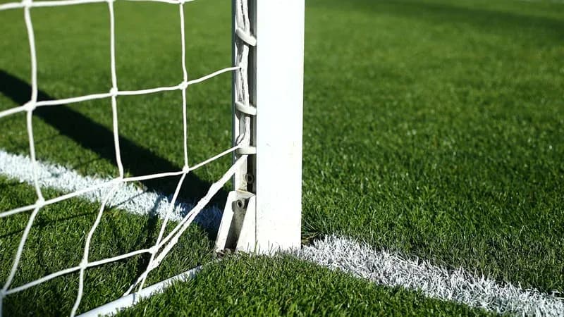 Close-up of soccer goalpost and net