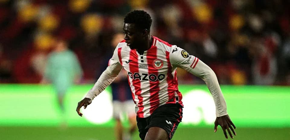 Brentford player running during a match
