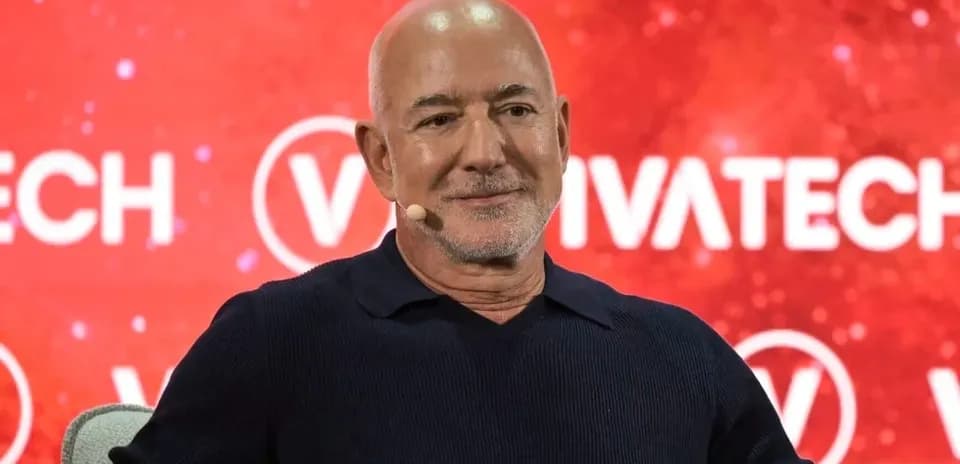 Speaker at VivaTech event with red background