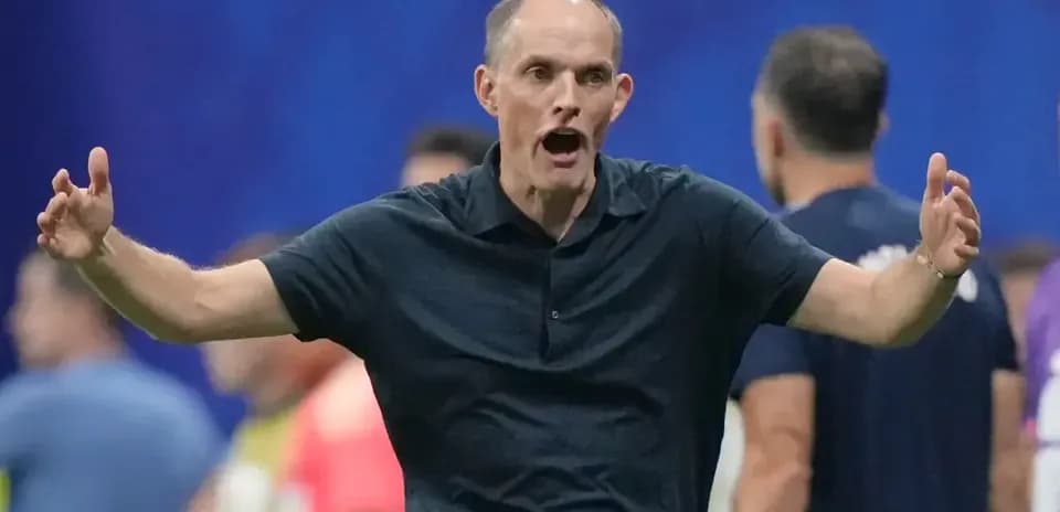 Coach gesturing animatedly during a match