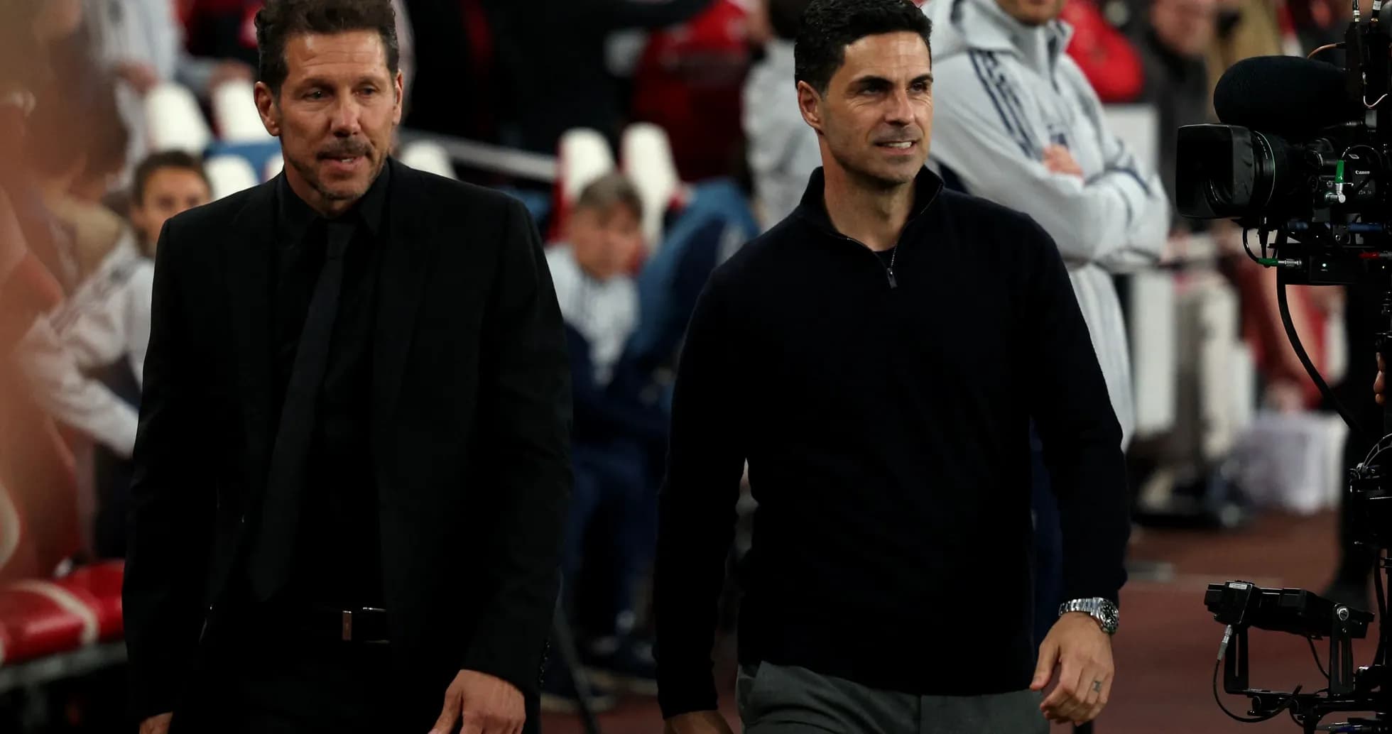 Two football managers walking before a match