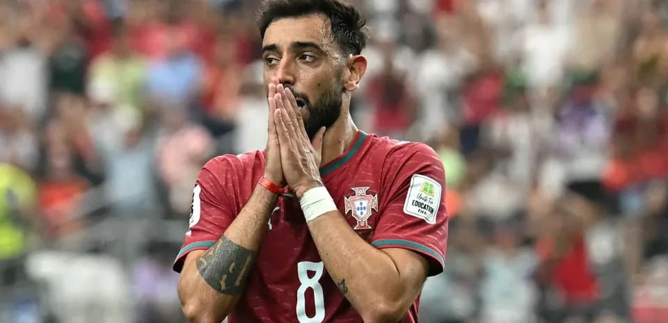 Player in Portugal jersey showing concern on field