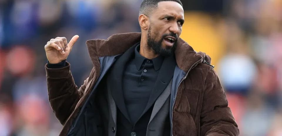 Coach gesturing during match on the sidelines