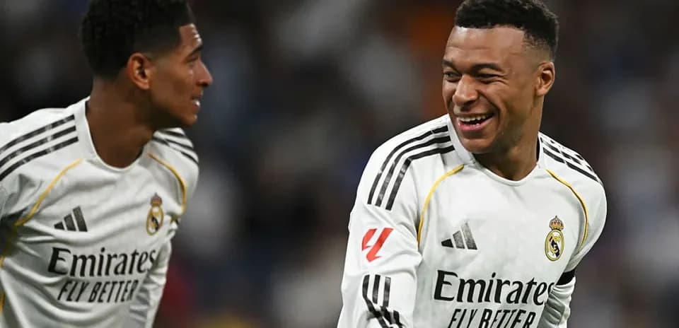 Two Real Madrid players celebrating on the field