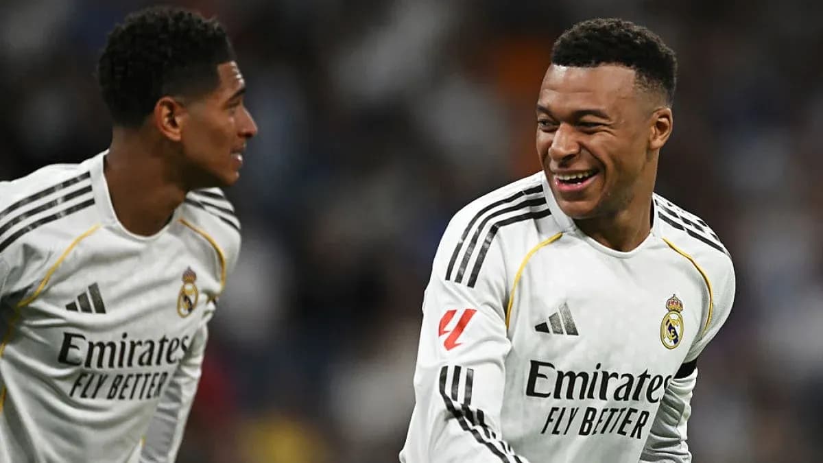 Two Real Madrid players celebrating on the field
