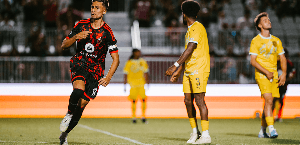New Mexico United player celebrating a goal