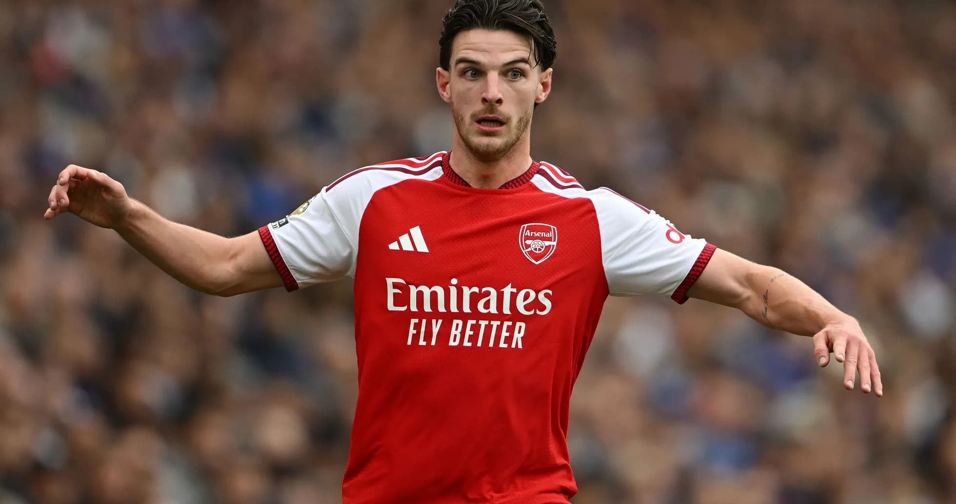 Arsenal player gesturing during a match