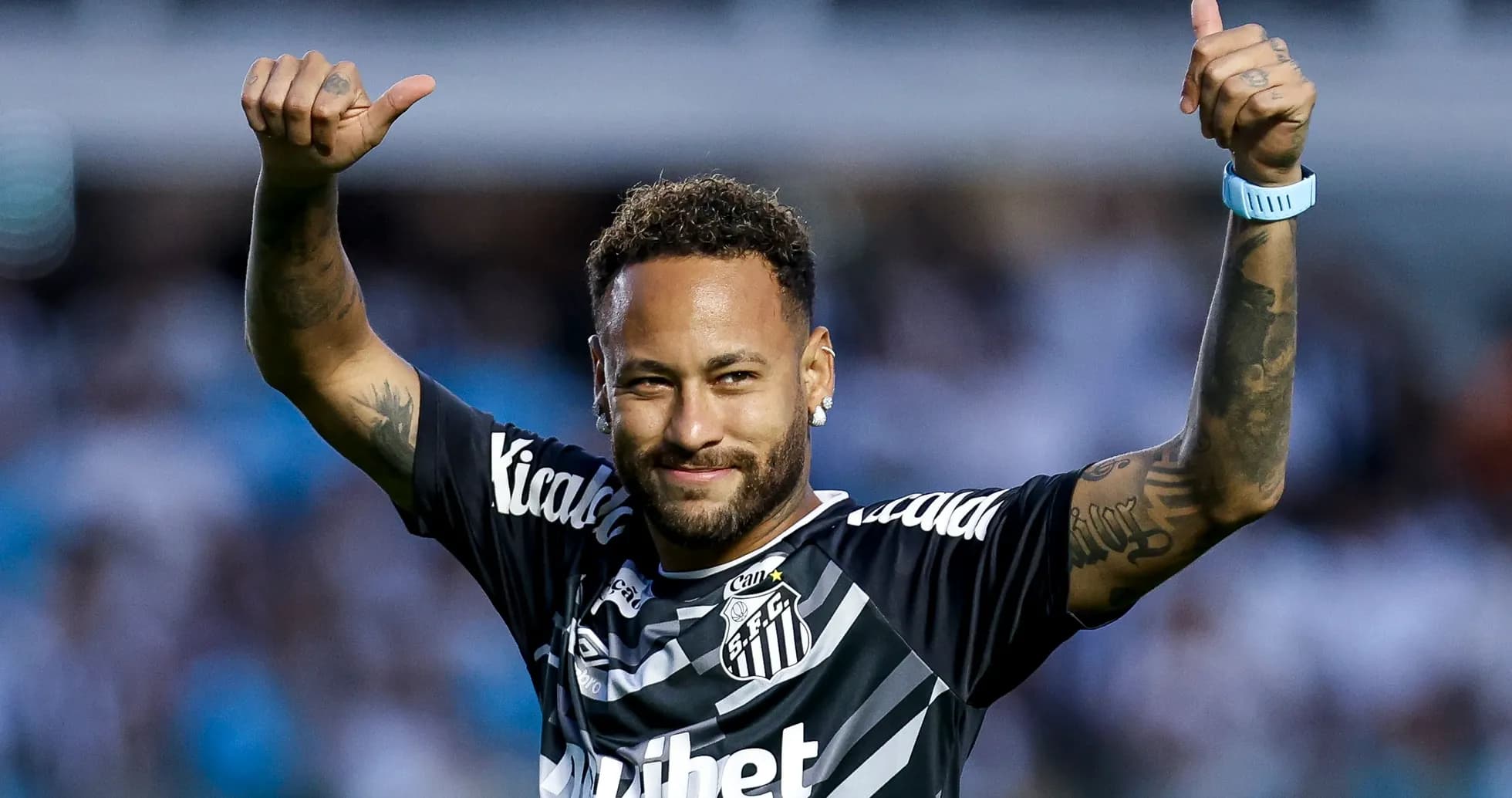 Player celebrating in Santos FC jersey with thumbs up