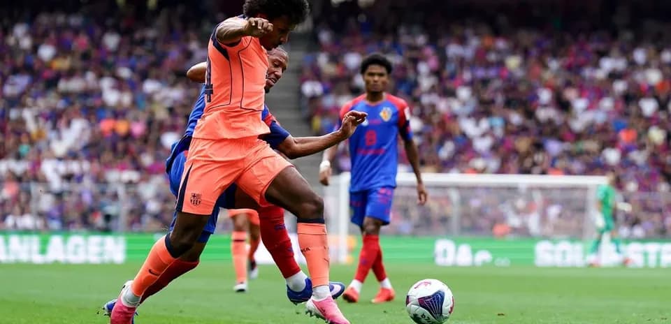 Player tackling opponent during a football match