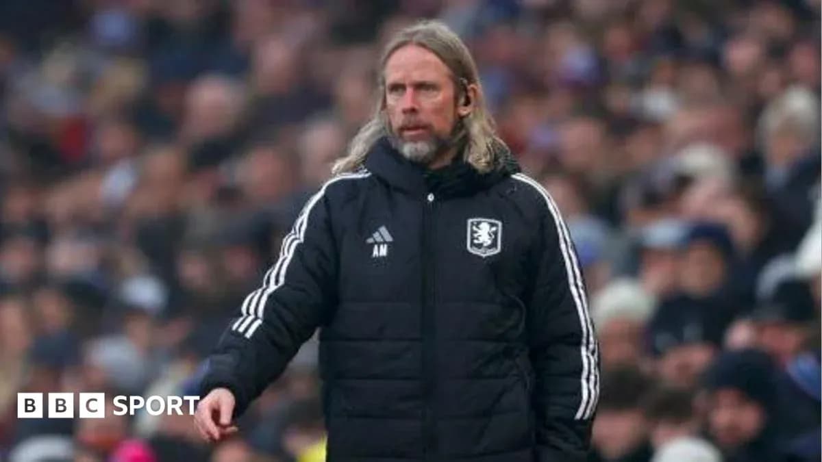Manager on sidelines during a football match
