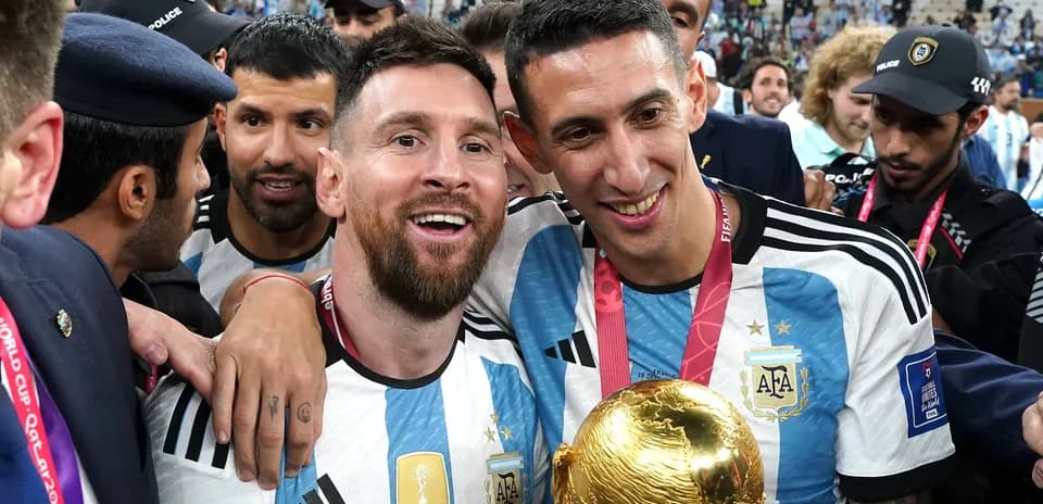 Players celebrating with FIFA World Cup trophy
