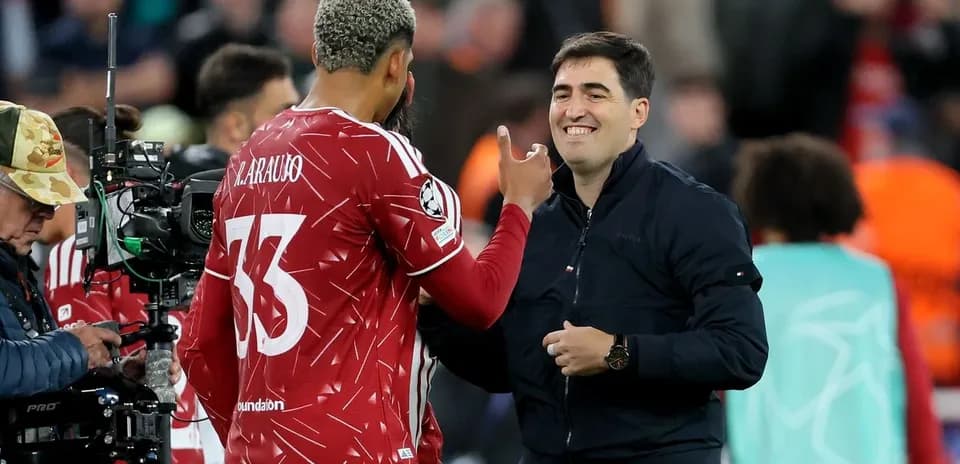 Player and coach interacting during match warm-up