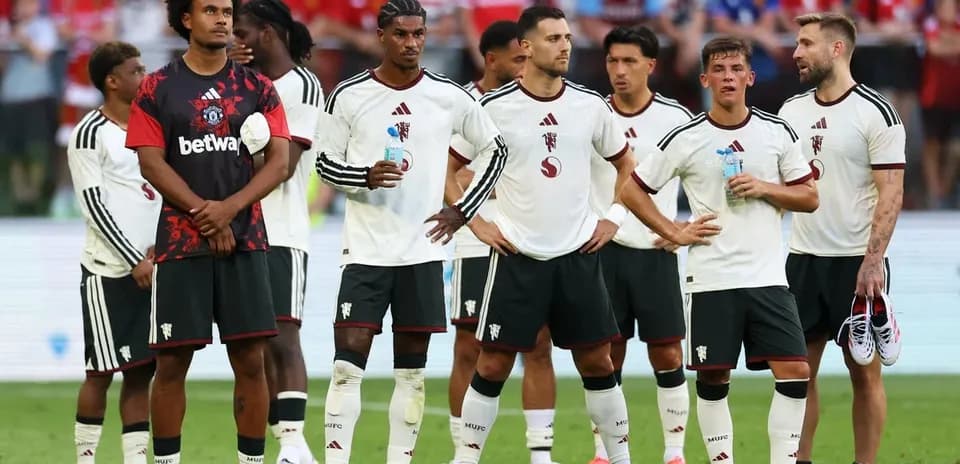 Football players standing together during match break