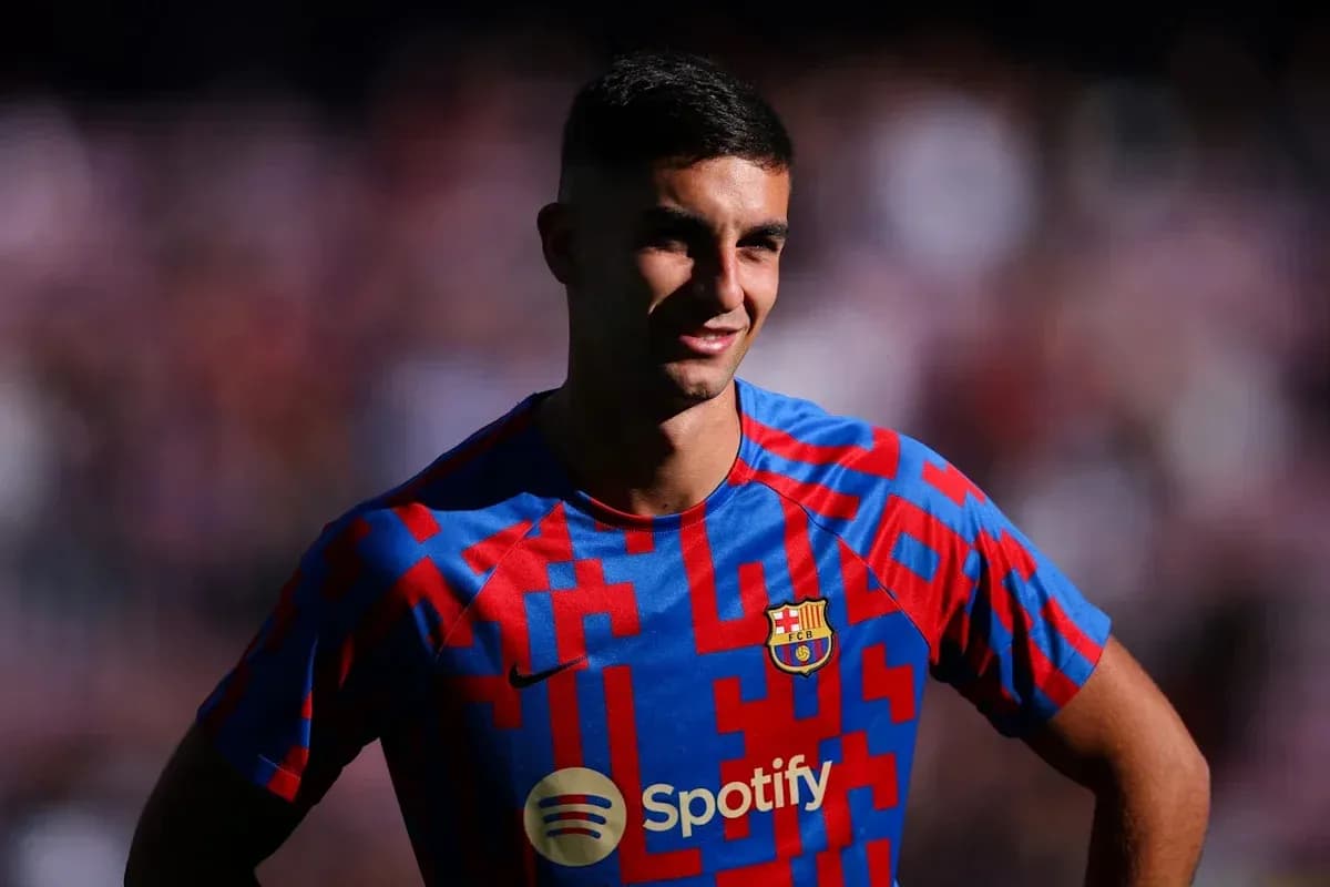 Player in Barcelona jersey smiling on the field