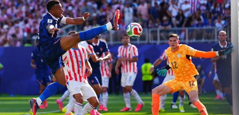 Player kicking ball during intense soccer match