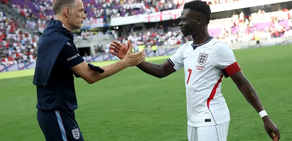 Coach and player shaking hands on the field