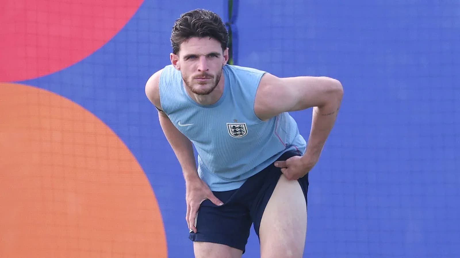 Player stretching leg during training session