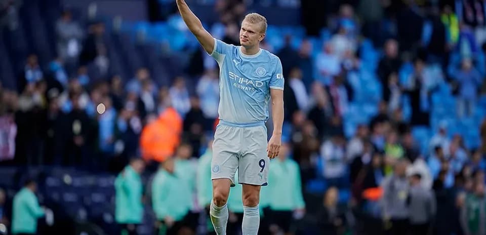 Player waving to fans after the match