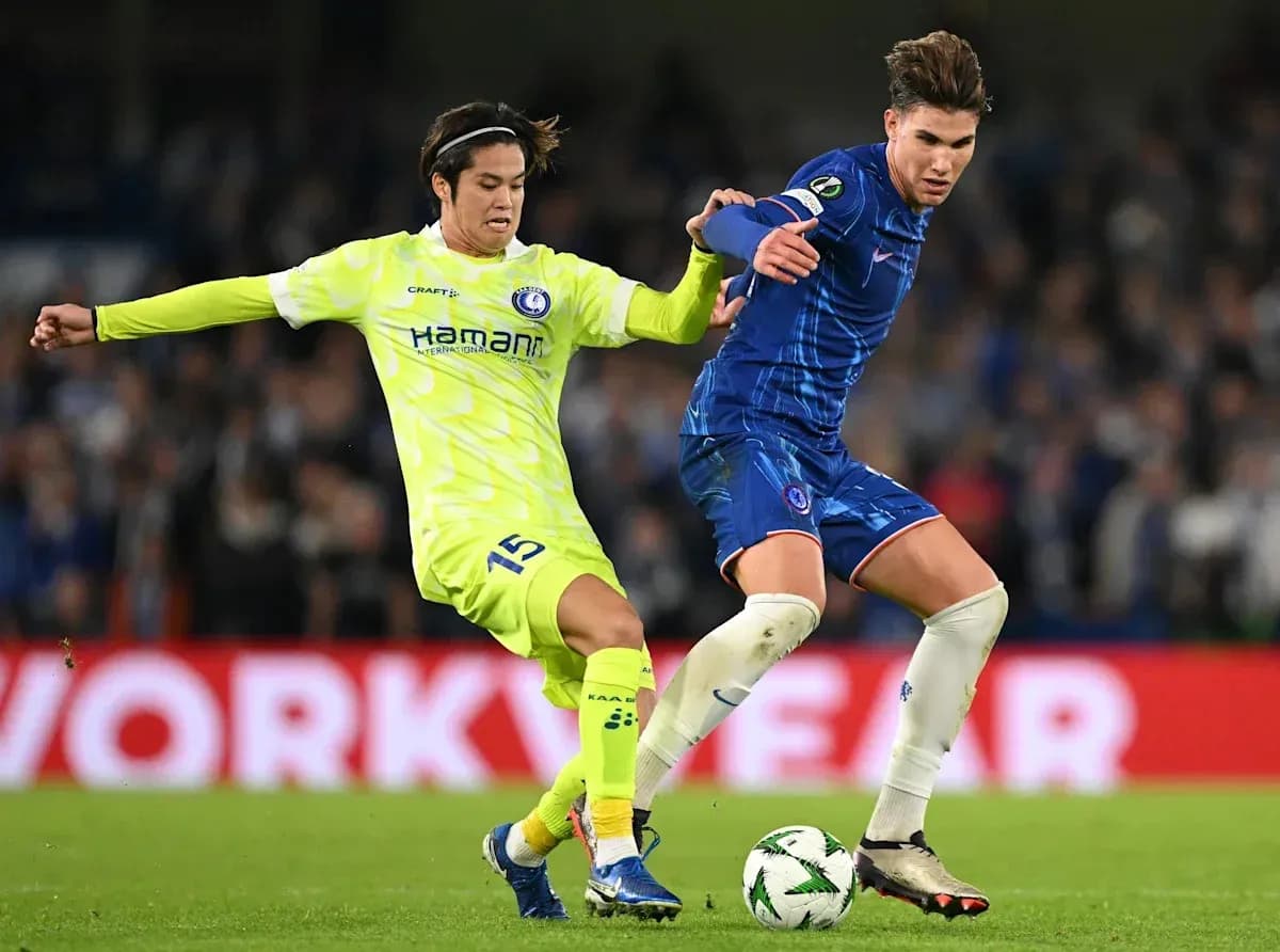 Two players battling for the ball during match