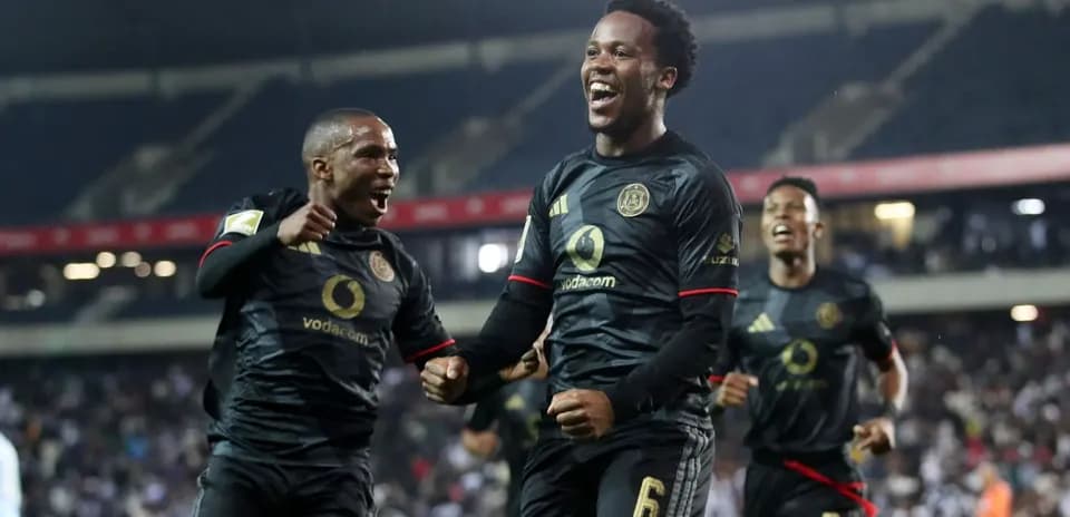 Players celebrating a goal during a match