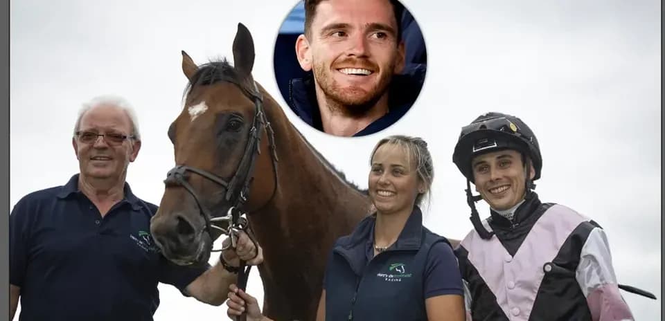 Group posing with horse at racing event