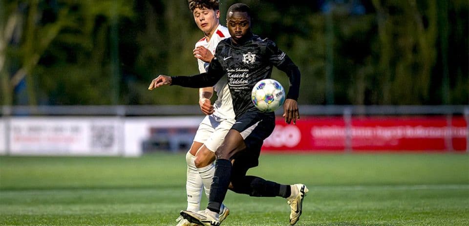 Players competing for the ball during match