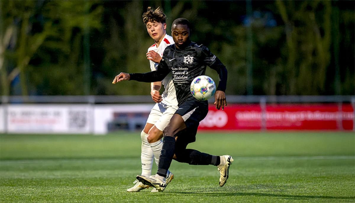 Players competing for the ball during match