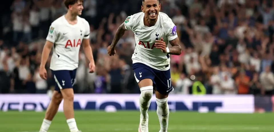 Player celebrating a goal with teammates during match
