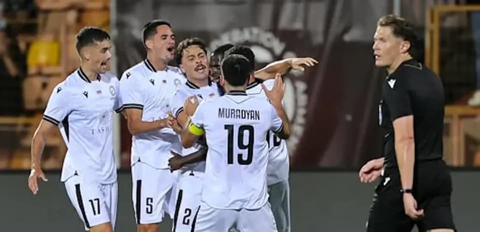 Players celebrating a goal during match