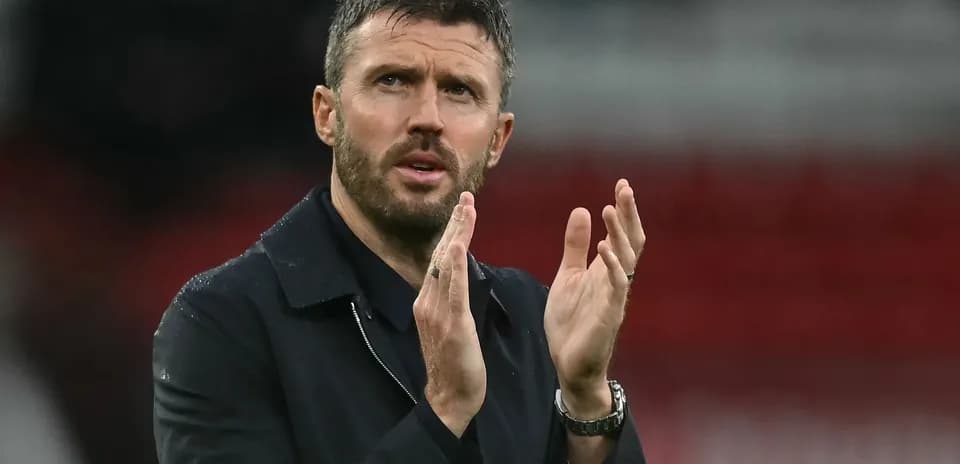 Coach applauding during a match at the stadium