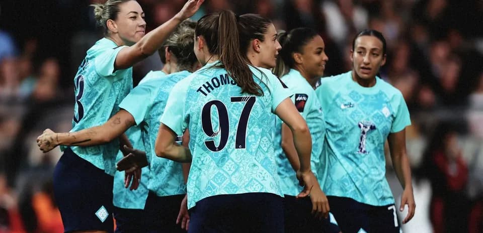 Team celebrating a goal on the field
