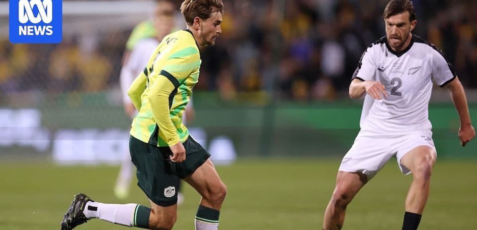 Player dribbling ball during Australia vs New Zealand match