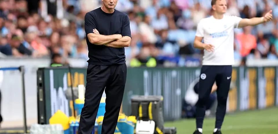 Coaches observing match from sidelines during game