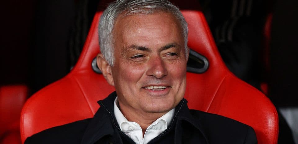 Coach seated on the bench during a match