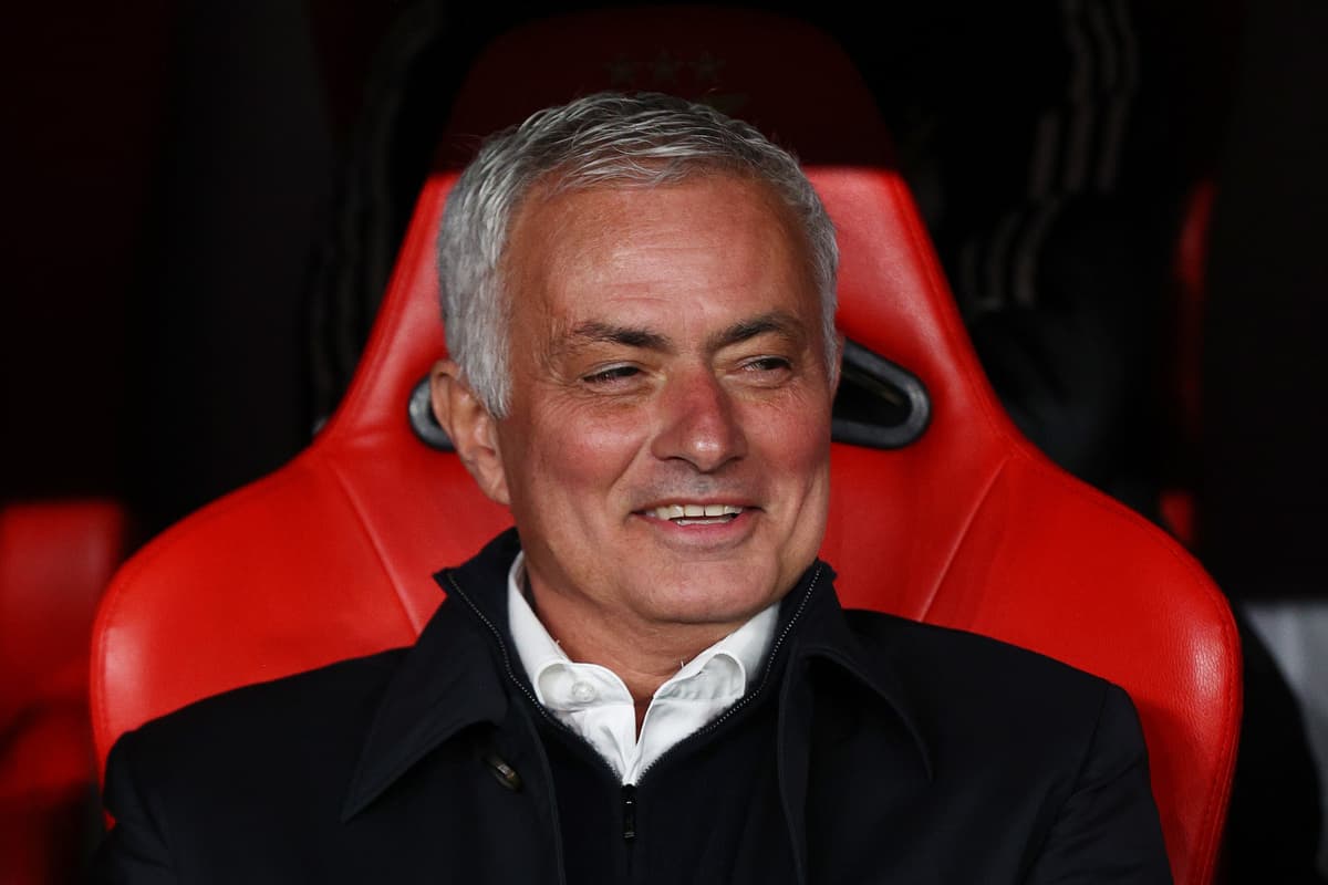 Coach seated on the bench during a match
