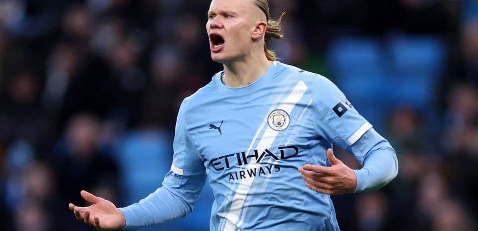 Player gesturing during match in light blue kit