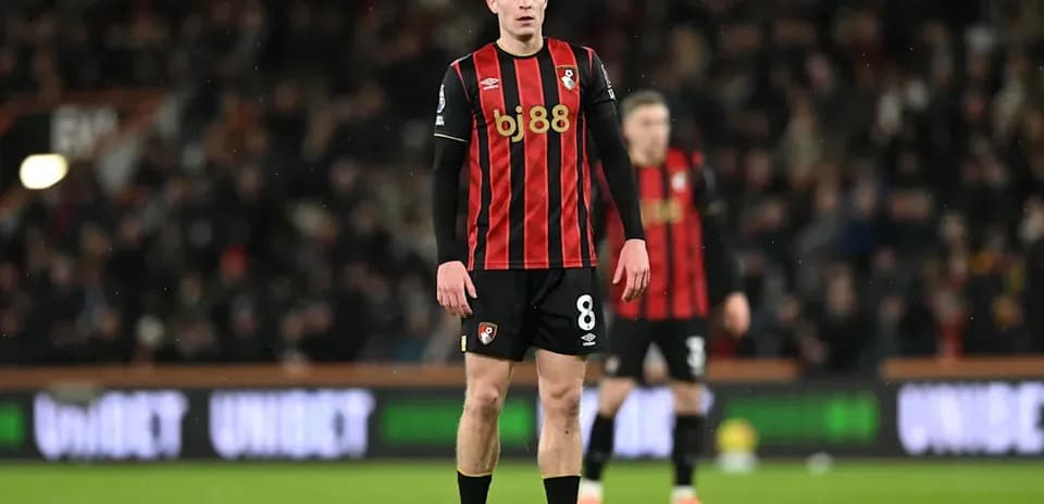 Bournemouth player standing on field during match