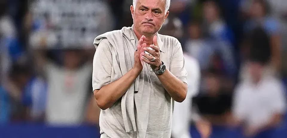 Coach applauding fans after the match