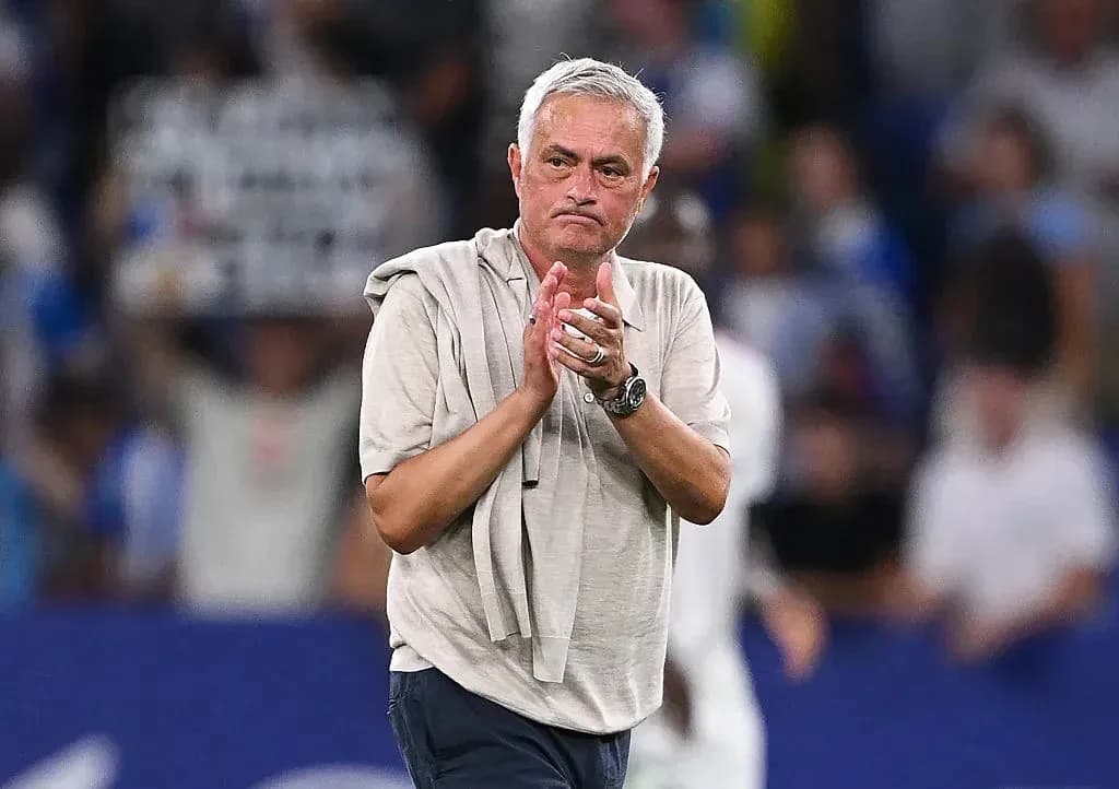 Coach applauding fans after the match