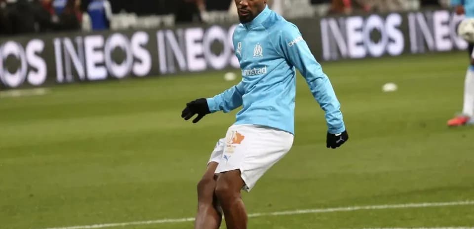 Player warming up on field before match