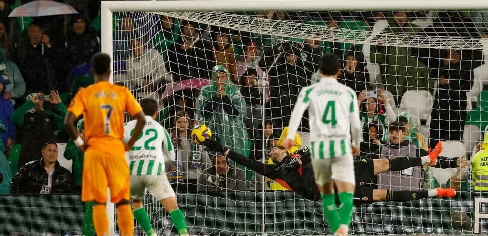 Goalkeeper saving a penalty during match